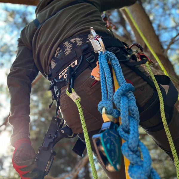 Rock Exotica Transporter XL on a climbers belt with equipment attached to it