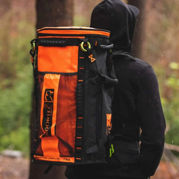 Orange Arbortec Cobra Gear Bag 65L feature - an arborist with the backpack in the field