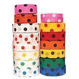Two stacks of polka dotted tape, in various colours.